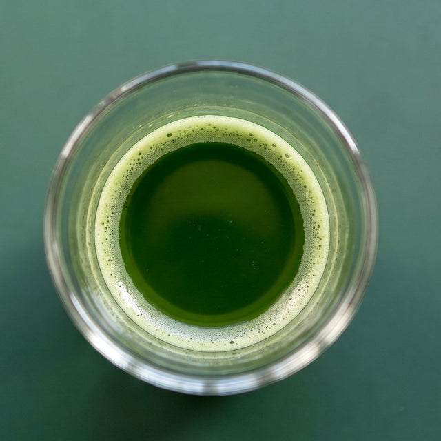 Concentrated matcha shot in a clear glass